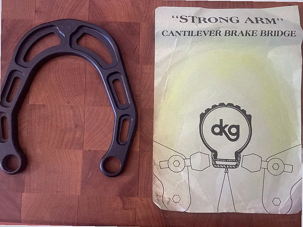 Vintage New-Old-Stock DKG "Strong Arm" Cantilever Brake Bridge • Black. (FSW)